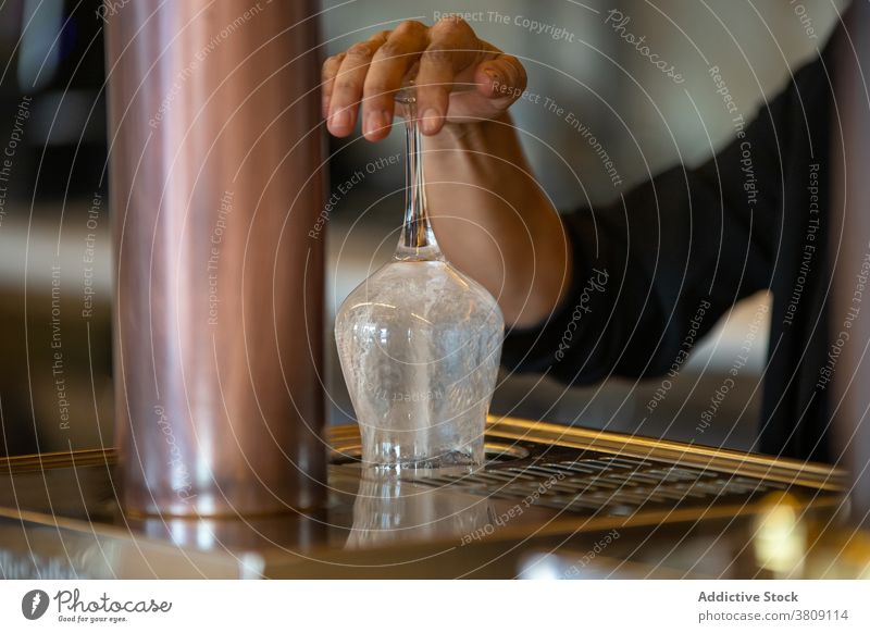 Bartender washing glass goblet with rinser beverage bar bartender equipment barman clean restaurant pub service professional hand wineglass water glassware