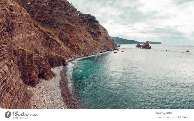 Sharp cliff on the coast of Vizcaya in Spain beach nature sharp vizcaya basque country copy space travel stone high water view rock ocean landscape coastline