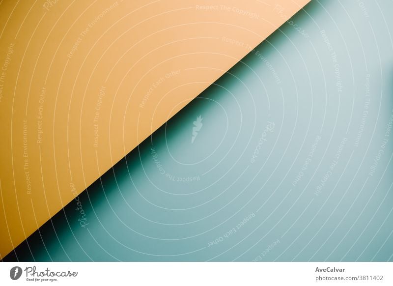 Yellow and blue pastel flat lay background with sharp layers and shadows with copy space concepts contrasts horizontal ideas imagination ornate university