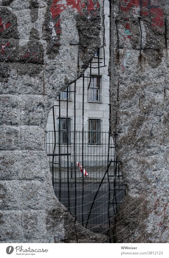 Through the hole in the wall you only see more fences and walls, sad grey world The Wall Berlin Wall (barrier) Hollow Concrete Reinforced Concrete Fence Grating