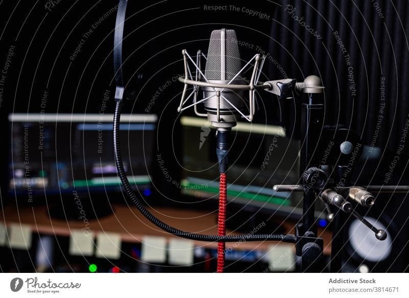Modern microphone in dark studio record music equipment computer modern sound audio professional gadget song melody electronic device metal wire broadcast