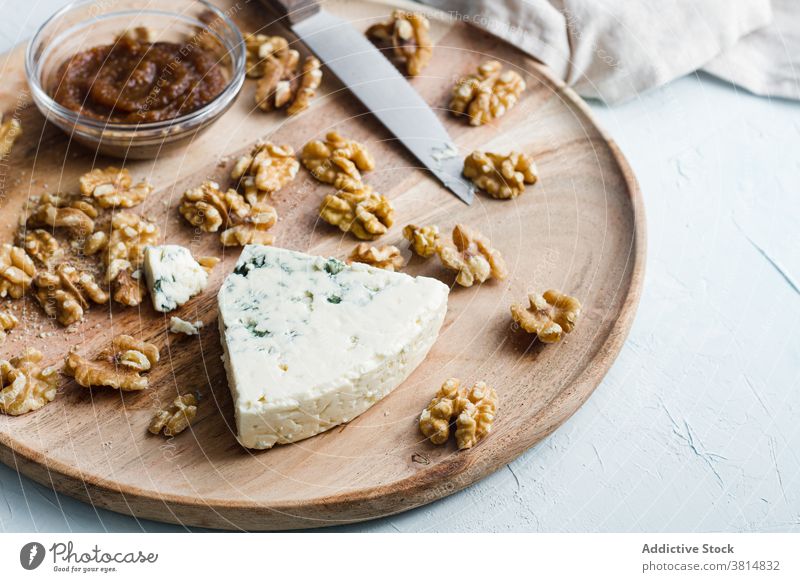 Tasty blue cheese on wooden board in kitchen cheesecake ingredient serve table palatable homemade jam tasty culinary prepare meal dessert cuisine fresh