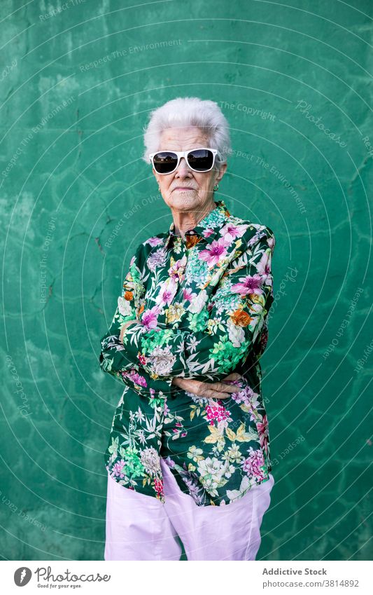 Stylish elderly woman in trendy sunglasses senior style hipster cool colorful outfit female fashion urban lifestyle bright individuality crazy happy cheerful