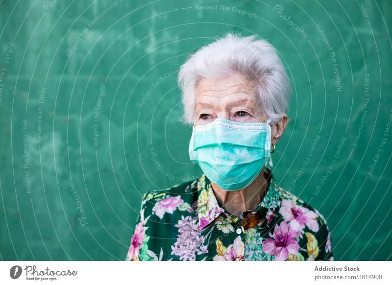 Senior woman in medical mask senior coronavirus optimist positive protect covid 19 covid19 pandemic elderly sign female cheerful show confident style friendly