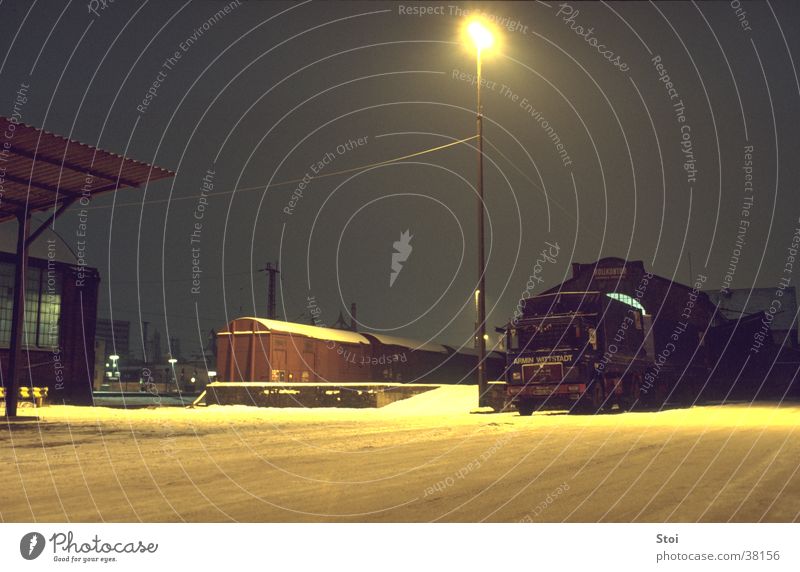 Goods station at night Freight station Railroad Night Cold Loneliness Winter Street lighting Train station Snow Calm Industrial Photography