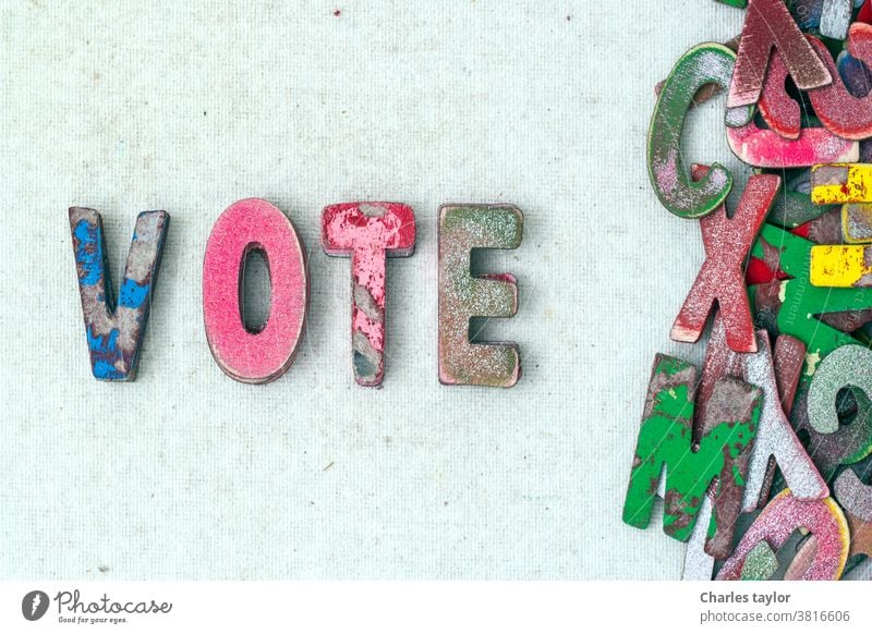 the word VOTE with old wooden letters vote voter politics concept symbol background voting text government choice president democracy america usa political