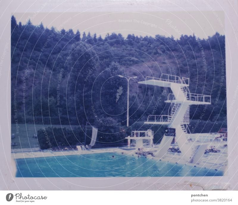 White diving tower in the outdoor pool. Summer. Polaroid diving platform Open-air swimming pool Jump height Brave fun Joy swimming pools Swimming & Bathing
