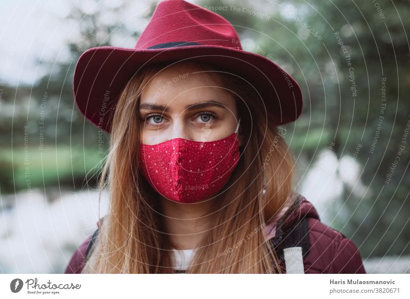 Beautiful woman with red hat and face mask close up adult attractive beautiful beauty caucasian cold coronavirus covid-19 cute fashion female girl lifestyle