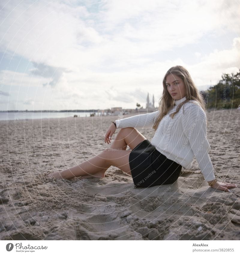 Blonde girl at the Baltic Sea beach Landscape Beach Intensive teen kind Nature feminine Uniqueness Exceptional natural light Looking into the camera Observe