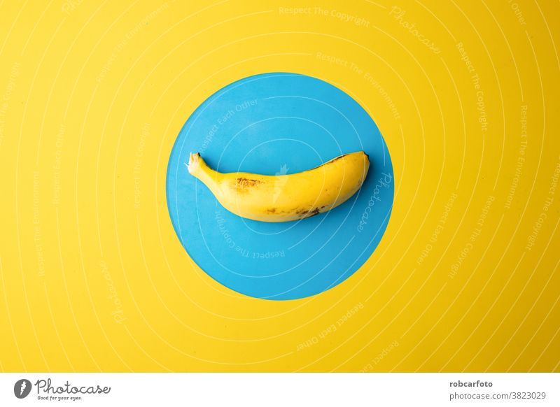 banana in yellow and blue background fresh healthy closeup tropical food ripe snack fruit peel white isolated sweet bunch group stack open flesh vitamin
