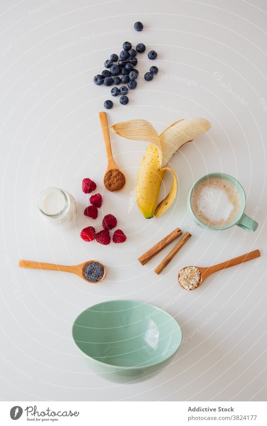 Ingredients for healthy breakfast on table bowl berry banana seed milk food ingredient assorted various recipe morning prepare fresh meal organic nutrition