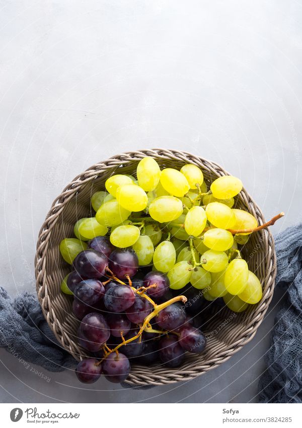 White and dark grapes in a basket fruit autumn winter still life food fall contrast abstract minimal wine white beautiful nature berry flat lay top view above
