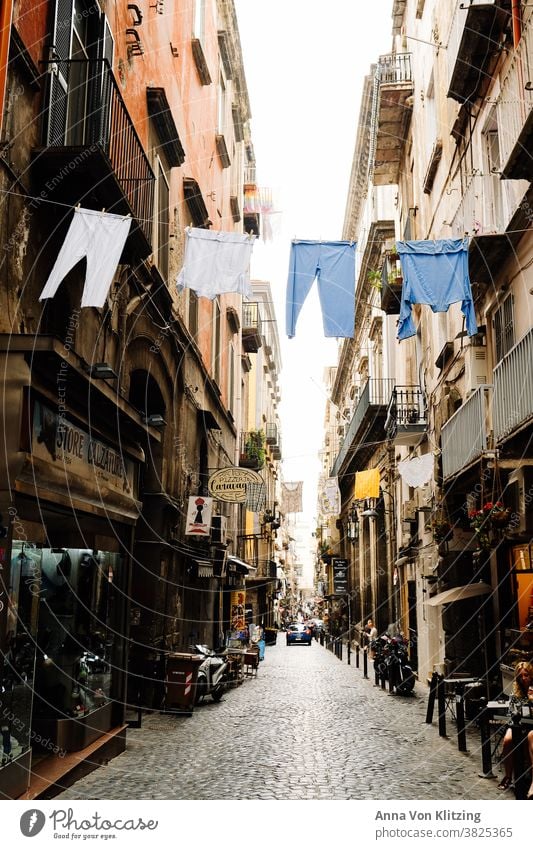 Laundry line in Naples clothesline garments Pants down Dry Italy Street Alley