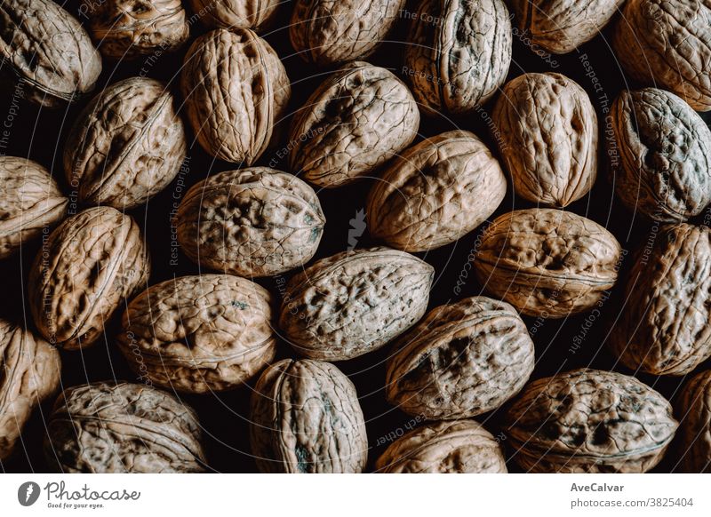 Background filled with nuts from above food brown kernel ingredient tasty diet pecan protein nutrition organic raw snack healthy seed natural dry view pistachio