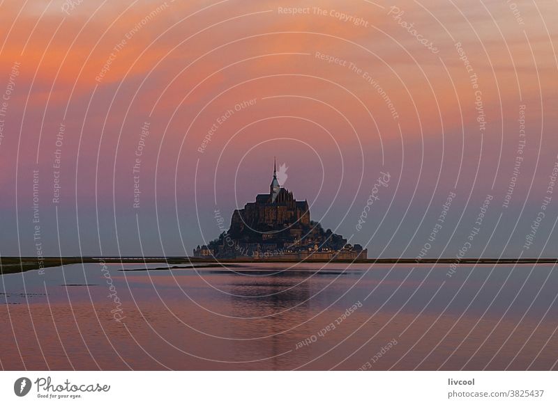 mount st michael at sunrise, normandy light abbey mont saint michel church hill place famous place tourist place cloudy pink sunset lovely nice cool reflection