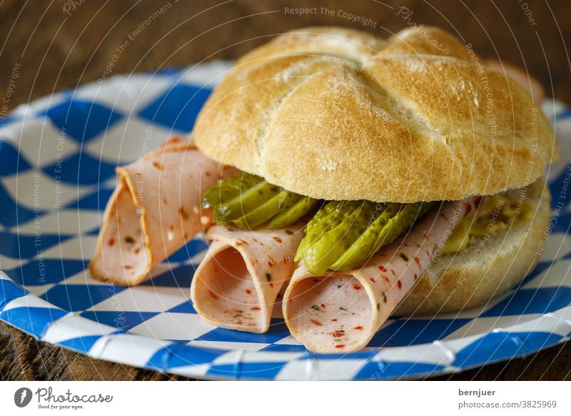 Bread roll with sausage on wood Roll Snack sausage roll Fresh Meat Bavaria Slice Cut snack Eating Kitchen Pork Germany background tribunal Bavarian Gourmet