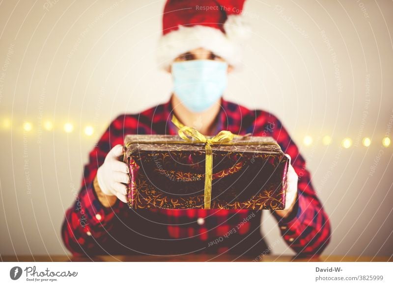 Corona - Christmas in quarantine corona Quarantine Man infected pandemic Respirator mask Mask Gift Giving of gifts by oneself