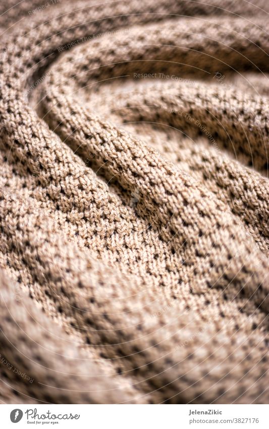 Knitted beige blanket texture background knit pattern warm wool fashion macro woolen woven cashmere soft fabric thread winter decorative natural material