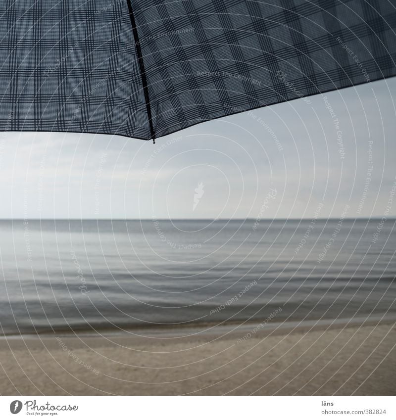 Covered Vacation & Travel Tourism Beach Ocean Environment Nature Landscape Sand Sky Loneliness Leisure and hobbies Checkered Umbrella Bad weather Horizon