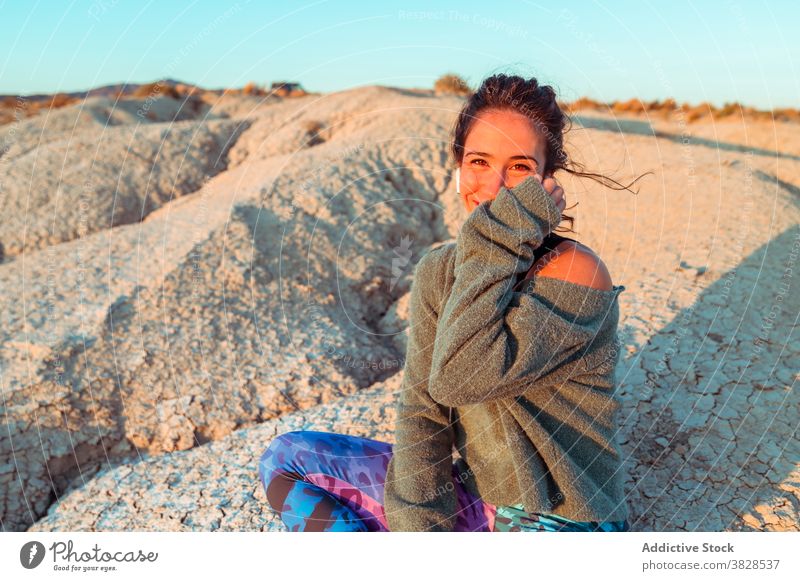 Woman enjoying sunset in desert valley woman badlands sporty peaceful contemplate relax tranquil nature female rough serene evening harmony rock sundown freedom