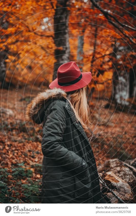 Woman with hat exploring the autumn forest autumn colors autumn leaves autumn vibes background beautiful beautiful woman caucasian celebration clean clothes