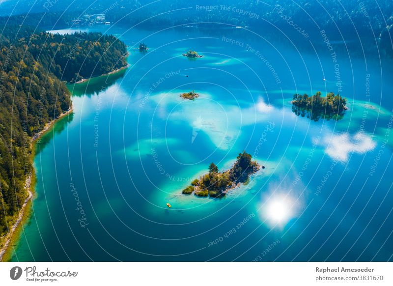 Aerial view of Eibsee lake, little islands in turquoise water aerial alps aquatic bay beach beautiful blue boat coast day eibsee europe forest germany green