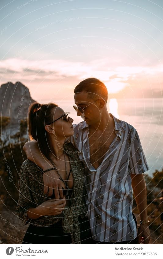 Loving couple hugging in nature at sunset love gentle evening style together relationship sundown sky romantic boyfriend affection casual embrace relax tender