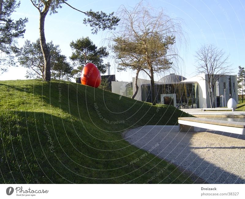 Red egg in the green Easter egg Park Obscure Egg Modern Architecture