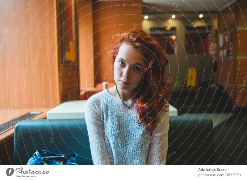 Serene woman resting in cafe red hair redhead relax calm appearance charming weekend chill female saint petersburg russian federation cozy sit casual style
