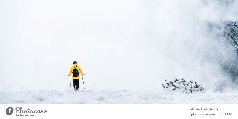 Unrecognizable traveler in mountains in winter snow trekking hike pole nature highland mountaineer pyrenees mountains andorra hiker adventure landscape explore