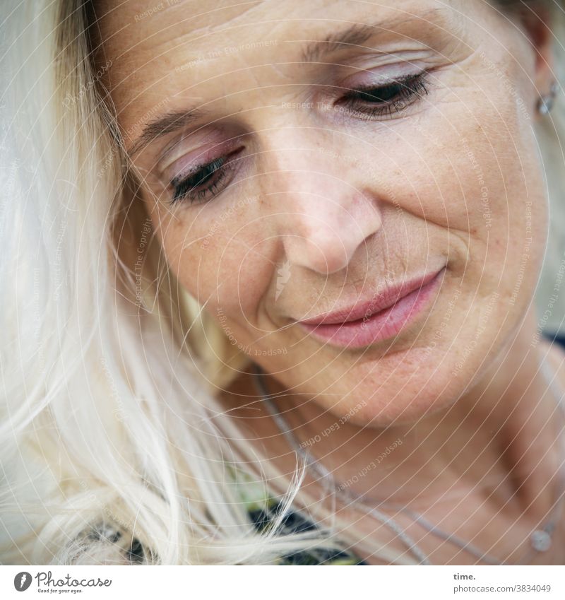 Fadila Downward portrait Feminine Woman Blonde warm Smiling