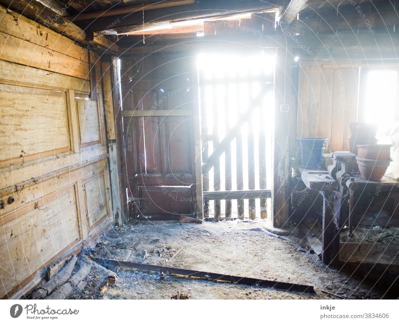 Old shed against the light Colour photo Exterior shot Back-light Day Sunlight Flake Deserted Derelict Transience frowzy Wooden door Wooden wall Woodshed