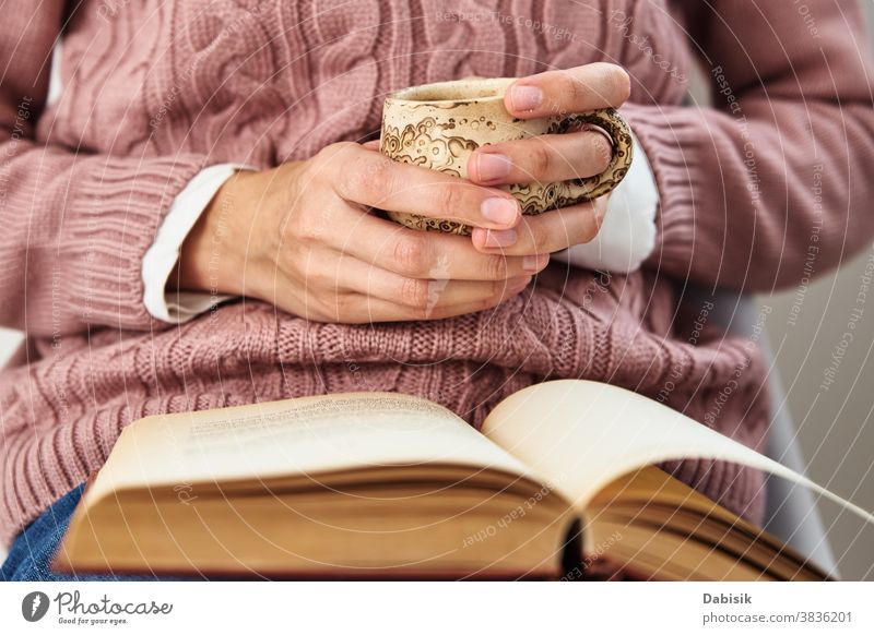 Woman sitting and reading a book. Relaxing concept page relax education turn open row document knowledge science stack old person people adult lifestyle