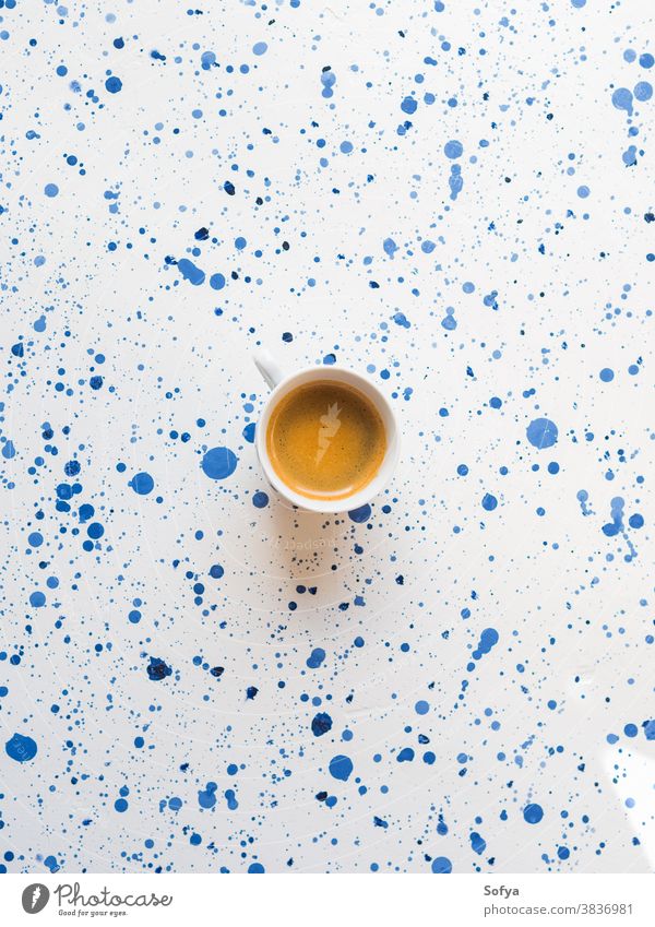 Cup of coffee on abstract background. Flat lay cup espresso drink hot morning breakfast food concept italian beverage relax white blue texture bright paint