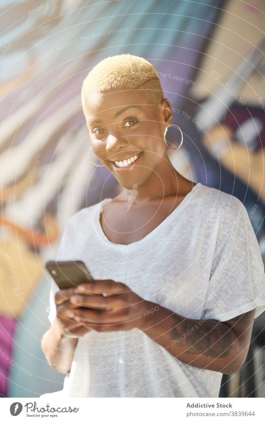 Cheerful black woman on smartphone self portrait cheerful relax having fun sunny cafe using female ethnic african american smile modern casual happy mobile