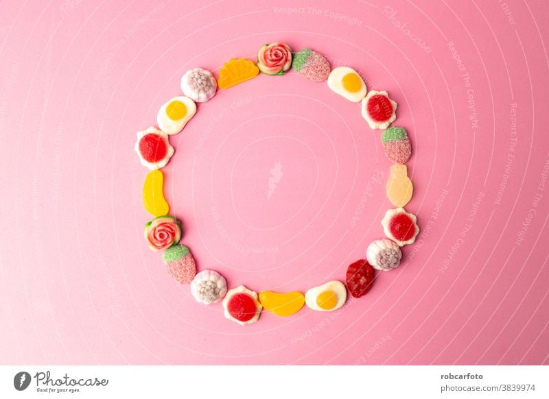 candy, sugar on pink background food colorful sweet dessert closeup confectionery holiday bright orange delicious red group jelly texture unhealthy fruit tasty