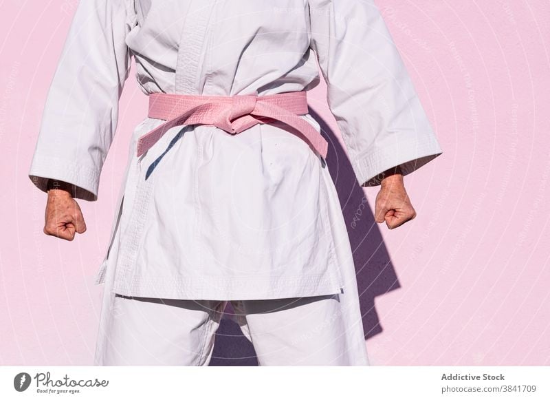 Anonymous karate woman who has defeated cancer martial sport campaign awareness health female fighter pink confident disease remission strong oncology recovery