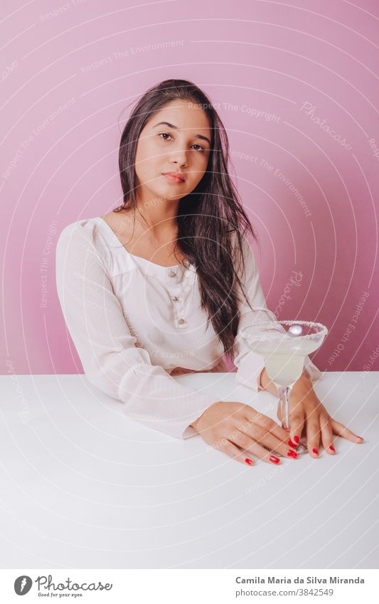 Young woman with margarita drink background beautiful brazilian delicious fashion girl lifestyle party portrait relax smile smiling studio women young