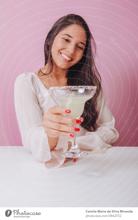 Young woman with margarita drink background beautiful brazilian delicious fashion girl lifestyle party portrait relax smile smiling studio women young