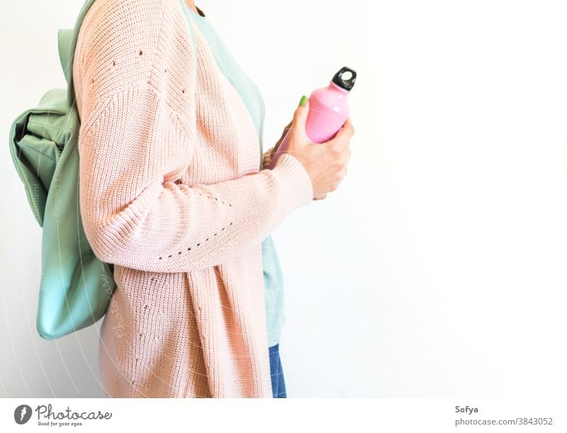Women stay with Backpack with reusable water bottle in a pocket - a Royalty  Free Stock Photo from Photocase