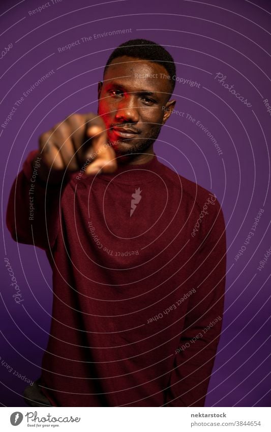 Man Pointing at Camera black pointing finger looking at camera medium shot you hand sign hand gesture selection call to action African ethnicity one person man