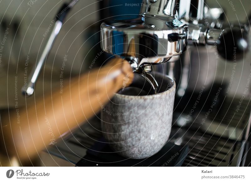 Strainer on a portafilter machine with a glazed clay coffee mug underneath. An espresso is prepared screen carrier Espresso Coffee Café Close-up espresso powder