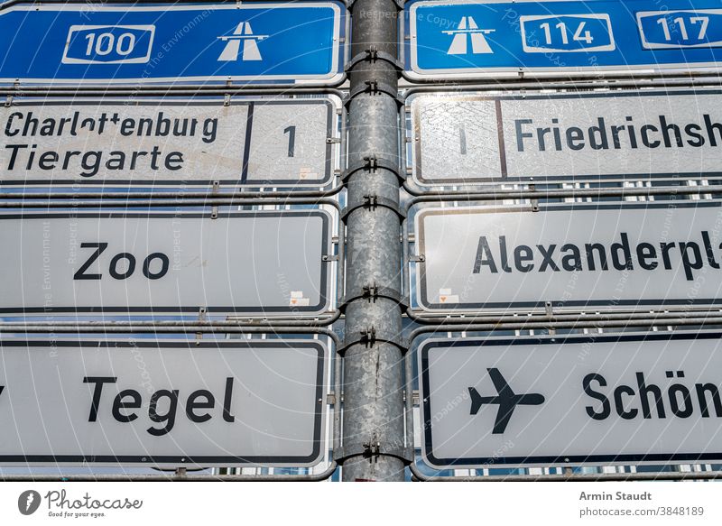 Close up of information signs from Berlin traffic direction motorway zoo alexanderplatz tegel airport km kilometer number letters metal outdoor street urban