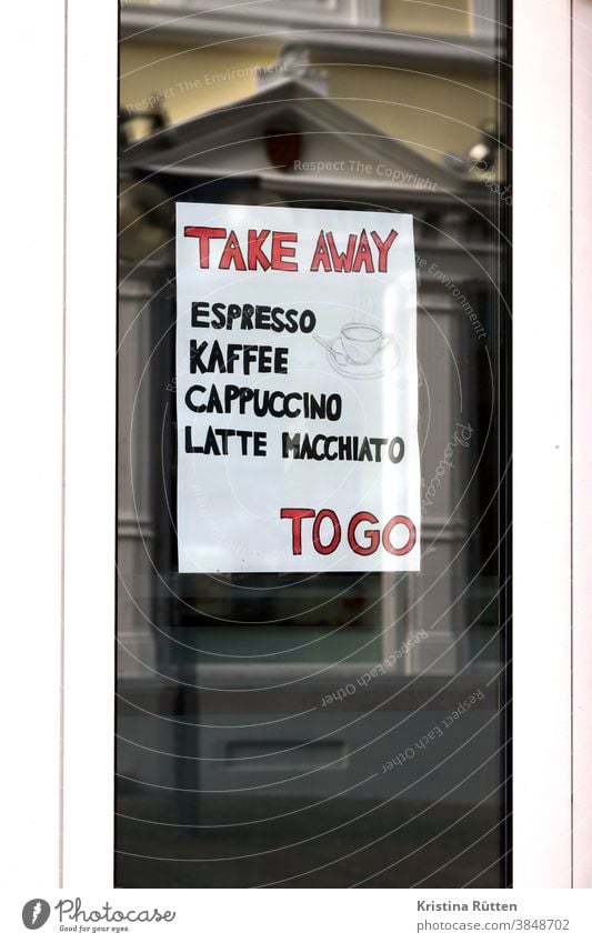 sign with take away offer in the window of a local to go Coffee Espresso Cappuccino Latte macchiato hot drinks In transit out street sale lockdown Gastronomy