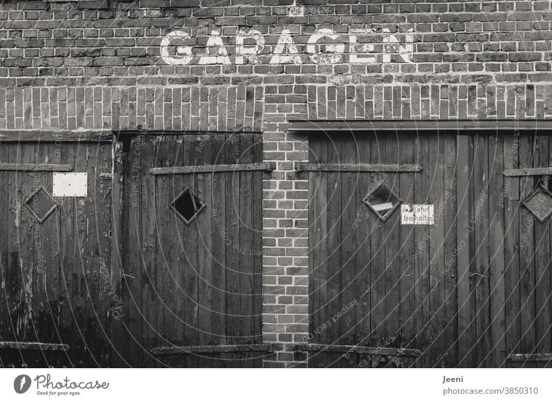 Two old sad garages Garage Garage door Garage doors Wall (building) Wall (barrier) Brick wall Gloomy Old two Building House (Residential Structure) Gray Goal