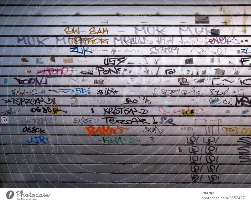 Tagged metal gate Goal Metal street art Daub Graffiti Characters Wall (building) Youth culture Street art Closed