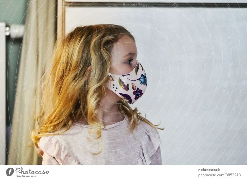 Blond Female Child Profile with Protective Face Mask child girl portrait mask profile protective face mask blond caucasian lifestyle female looking away