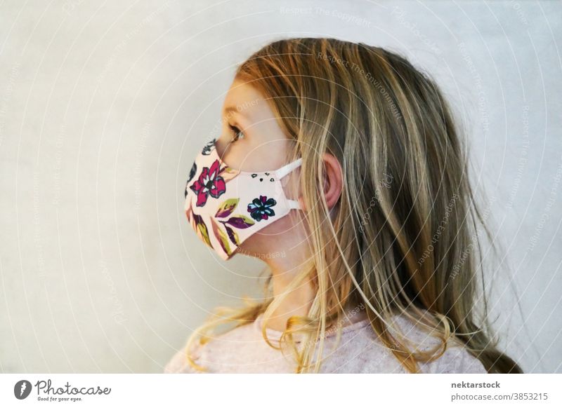 Blond Girl Profile Wearing Protective Face Mask child girl portrait mask profile protective face mask blond caucasian lifestyle female looking away head turned