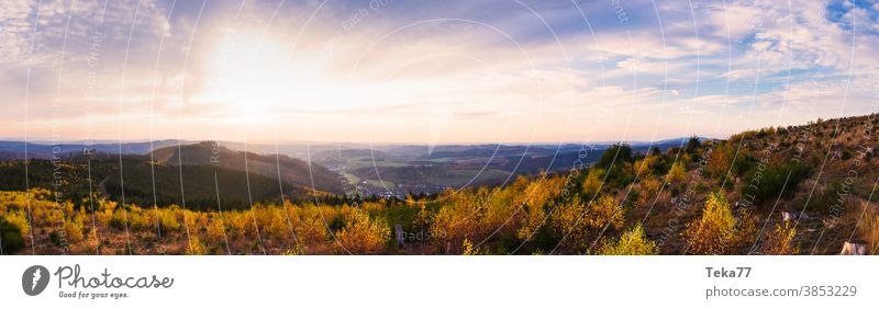 the rothaar mountains in germany with a view towards siegen city as panorama rothaargebirge siegerland nature high definition panorama yellow green clouds
