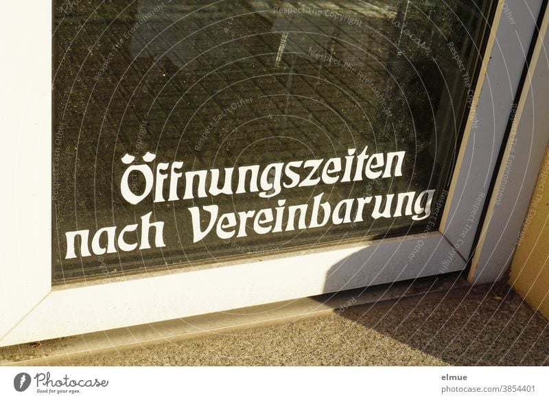 "Opening hours by appointment" is written in white print in the lower part of a glass door to a shop. opening hours Agreement shop door Exceptional situation